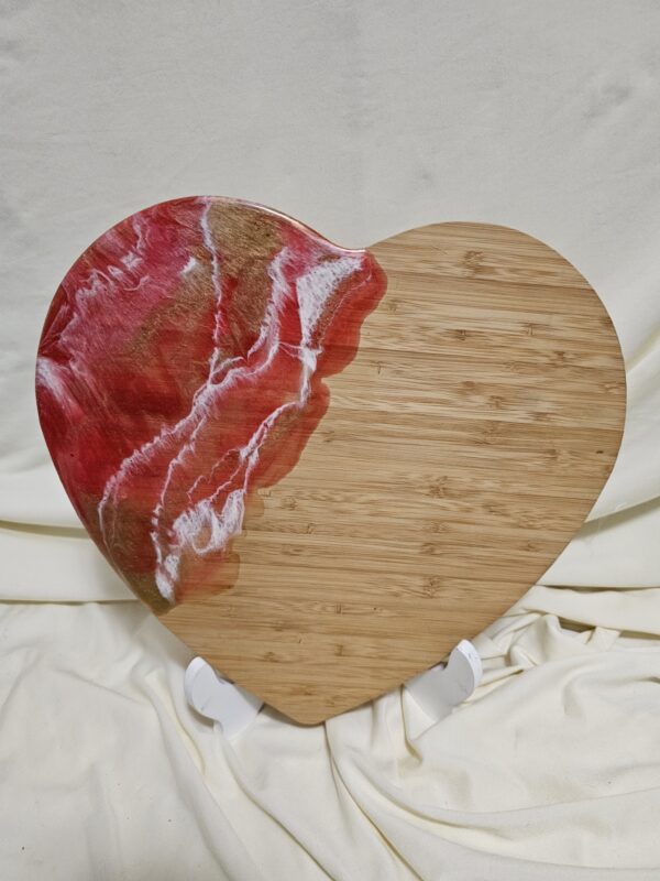 heart shaped charcuterie with red white and gold resin