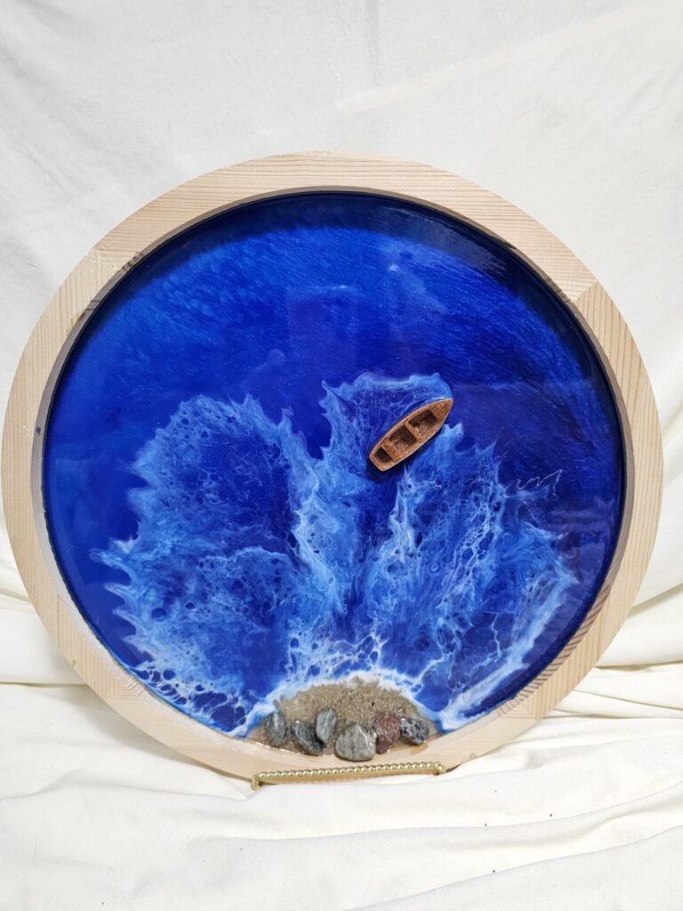 Wall art of Ocean Resin with Shells in a Circle with boat