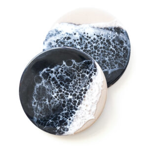 Dramatic black resin with subtle wave-like textures, evoking the mystery and alure of the deep sea at night.